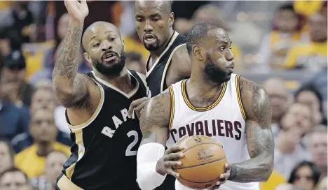  ?? TONY DEJAK/THE ASSOCIATED PRESS ?? If LeBron James and the Cleveland Cavaliers continue their one-sided run past the Raptors, it might give Toronto management pause to consider whether to offer Serge Ibaka, centre, a new long-term contract after the season, writes Scott Stinson.