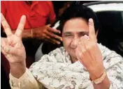  ?? PTI ?? BSP supremo Mayawati shows her inked finger after casting her vote in the third phase of the UP assembly elections in Lucknow on Sunday