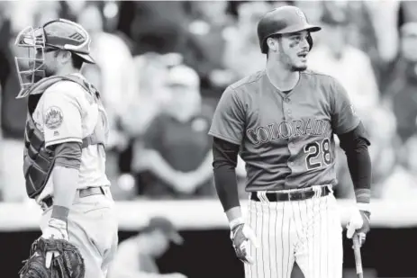  ?? Matthew Stockman, Getty Images ?? Nolan Arenado reacts to a called ball four with the bases loaded to win the game Thursday.