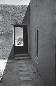 ?? Georgia O’Keeffe Museum ?? In “North Patio Corridor,” O’Keeffe shoots shadows on the walls of her New Mexico home.