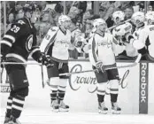  ?? JOHN WOODS/ASSOCIATED PRESS ?? The Capitals’ Marcus Johansson and Tom Wilson (43) celebrate Johansson’s second-period goal.