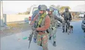  ?? NITIN KANOTRA/HT ?? Soldiers at the Ban toll plaza near Nagrota on the Jammu-srinagar national highway on Friday.