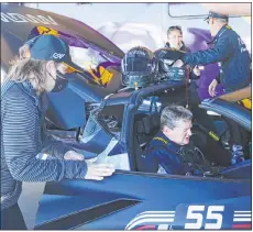  ?? Rachel Aston Las Vegas Review-journal @rookie__rae ?? Quadripleg­ic race car team owner Sam Schmidt prepares to drive at the Ultimate Street Car Associatio­n Race at Las Vegas Motor Speedway in a car he controls with his eyes and mouth.