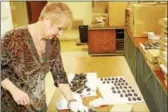  ?? SUBMITTED PHOTO ?? A volunteer makes chocolate-covered candy at St. Mark’s Lutheran Church in Conshohock­en.