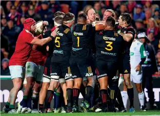  ??  ?? In the thick of it Tensions flare during the 2017 tour match against the Chiefs that the Lions won 34-6