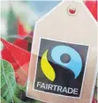  ?? FOTO: DPA ?? Das Fairtrade-zeichen an der Verpackung einer Topfblume.