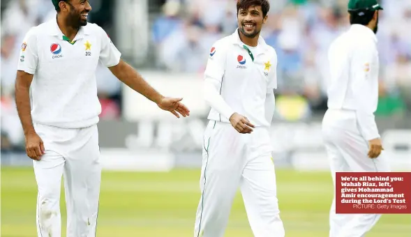  ?? PICTURE: Getty Images ?? We’re all behind you: Wahab Riaz, left, gives Mohammad Amir encouragem­ent during the Lord’s Test