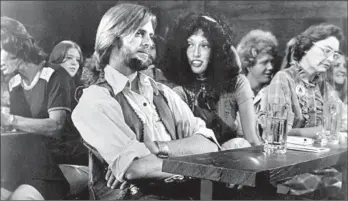  ??  ?? KEITH CARRADINE (who would win an Oscar for his song “I’m Easy”) and Shelley Duvall in “Nashville.”