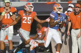  ?? John Raoux/AP ?? Florida wide receiver Antonio Callaway (81), right, runs for a 66yard touchdown play after catching a pass in front of Georgia safety Johnathan Abram