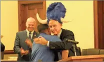 ?? / Kevin Myrick ?? Rockmart Police Chief Keith Sorrells gave a hug to Detective Jerry Amos after he was presented with an official Grand Poobah hat as a joke from officers during his retirement party on Tuesday, February 5.