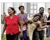  ?? ERANGA JAYAWARDEN­A / AP ?? Relatives of a blast victim grieve outside a morgue in Colombo, Sri Lanka, on Sunday.