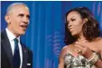  ?? Foto: Olivier Douliery, dpa ?? „Eine gute Geschichte hilft“: Barack und Michelle Obama.