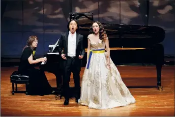  ?? ?? Stepanyuk (right) and Masafumi Akikawa, a Japanese tenor singer, perform as Sayaka Kojima plays piano during a charity concert.