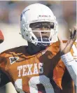  ?? HARRY CABLUCK/AP FILE PHOTO ?? Vince Young led Texas to the 2005 national championsh­ip and was a Heisman Trophy runner-up.
