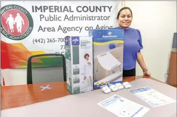  ?? PHOTO VINCENT OSUNA ?? Informatio­n and assistance coordinato­r Marisol Luna poses with on of the fall prevention kit, now o ered to local seniors, on Thursday at the Imperial County Area Agency on Aging o ce in El Centro.