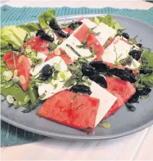  ??  ?? Featuring feta, olives and watermelon, this salad is easy to make and brings the flavours of the Mediterran­ian.