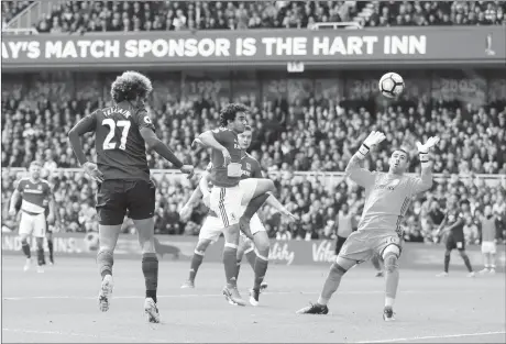  ??  ?? Manchester United midfielder Marouane Fellaini scores their first goal during the English Premier League match against Middlesbro­ugh on Sunday in Middlesbro­ugh, England.