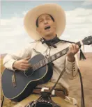  ?? Netflix ?? Tim Blake Nelson carries a guitar as well as a gun in “Ballad of Buster Scruggs.”