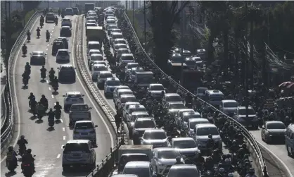  ?? Photograph: Achmad Ibrahim/AP ?? Vehicles are caught in congestion during rush hour in Jakarta, Indonesia. A new capital called Nusantara hopes to alleviate some of Jakarta’s woes.