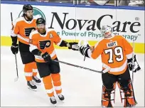  ?? FRANK GUNN — THE CANADIAN PRESS VIA AP ?? Philadelph­ia Flyers goaltender Carter Hart (79) celebrates a goal against the Montreal Canadiens with teammates Jakub Voracek (93) and Ivan Provorov (9) during the first period of an NHL Eastern Conference Stanley Cup first round playoff game in Toronto, Ontario Wednesday.