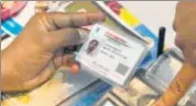  ?? AFP ?? A man validates his Aadhaar card using his thumb impression. The Supreme Court on Tuesday extended the deadline for linking Aadhaar to various services.