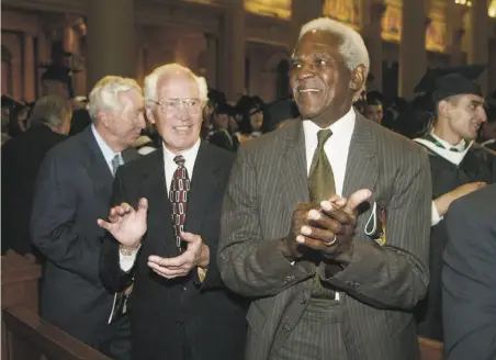  ?? George Nikitin / Associated Press 2006 ?? Burl Toler ( right) and Ralph Thomas, members of the undefeated 1951 University of San Francisco football team, attend the 2006 commenceme­nt, where team members were honored for refusing to play a bowl game without two of their black players.