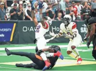  ??  ?? Storm receiver Damond Powell Jr. (22) fumbles with pressure from the Rattlers’ Davontae Merriweath­er in the United Bowl on Saturday night at Gila River Arena.