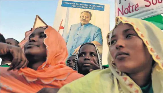  ??  ?? Subpoenaed to London: President Ismael Omar Guelleh, seen on a poster at a rally in Djibouti, will have to testify in court.