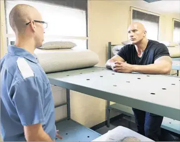  ?? Craig Litten HBO ?? DWAYNE JOHNSON, right, with cadet Avery Plemons in a scene from “Rock and a Hard Place” on HBO.