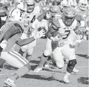  ?? JOHN RAOUX/AP ?? Florida State running back Cam Akers runs past Florida defensive back Duke Dawson, left, for a touchdown.