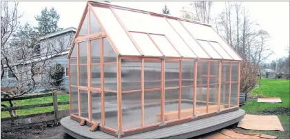  ?? DEAN FOSDICK VIA AP ?? This Feb. 10, 2013 photo provided by Dean Fosdick shows a hobby greenhouse in Langley, Wash., which was built in a sunny location capable of capturing an immense amount of summertime heat. It was later equipped with a timed irrigation system that...