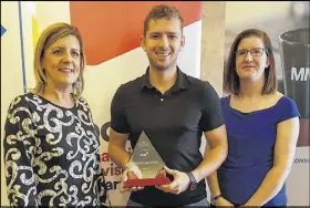  ??  ?? Business Growth Award - Coldstream Clear Distillery Michelle Bursey of award sponsor BDC with Riley Giffen of Coldstream Clear Distillery in Stewiacke and chamber president Joanne Mcrae.