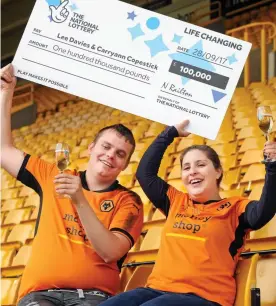  ??  ?? We won! Lee Davies and fiancee Carryann Copestick with cheque
