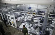  ?? DARIO LOPEZ-MILLS — THE ASSOCIATED PRESS FILE ?? Minors lie inside a pod March 30at the Donna Department of Homeland Security holding facility, the main detention center for unaccompan­ied children run by U.S. Customs and Border Protection, in Donna, Texas.