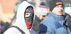  ?? BRACE HEMMELGARN/ USA TODAY SPORTS ?? Fans wait outside of U.S. Bank Stadium in zero-degree weather.