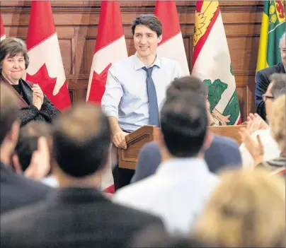  ?? CP PHOTO ?? Prime Minister Justin Trudeau receives a standing ovation from caucus members as he speaks at the Liberal national caucus meeting on Parliament Hill in Ottawa on Sunday.