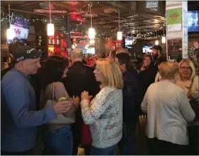  ?? ADAM DODD — THE NEWS HERALD ?? Ballentine, 4113Erie St., was jam-packed with a supportive crowd eager to celebrate with Charlie Schulz on March 1.