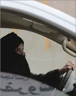 ??  ?? In this March 29, 2014, file photo, Aziza Yousef drives a car on a highway in Riyadh, Saudi Arabia, as part of a campaign to defy Saudi Arabia’s ban on women driving. AP PHOTO/HASAN JAMALI
