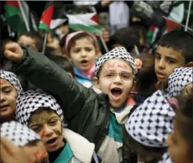  ?? BILAL HUSSEIN — THE ASSOCIATED PRESS ?? A girl with Arabic painted on her face that reads, “Jerusalem is for us,” chants slogans during a sit-in at the Bourj al-Barajneh Palestinia­n refugee camp in Beirut, Lebanon, on Wednesday. President Donald Trump is forging ahead with plans to recognize...