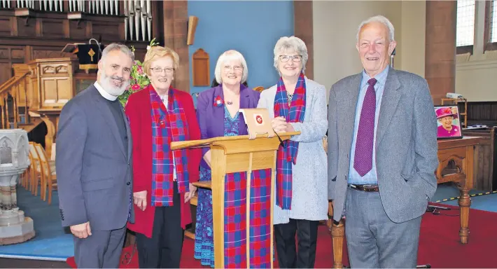  ?? ?? New addition Pictured after the dedication of the Guild lectern at Blairgowri­e Parish Church on Sunday are , from left, Rev Benjamin Abeledo, Margaret Conroy, Mary Macdonald, Colleen Joslin, and Chris Joslin who designed and constructe­d the lectern. Pic: David Phillips