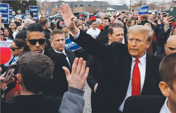  ?? Picture: Getty Images via AFP ?? Donald Trump visits a polling site in Londonderr­y, New Hampshire, on primary day.