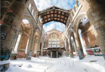  ?? KYLE TELECHAN/POST-TRIBUNE ?? Snow covers the floor of the sanctuary in the abandoned United Methodist Church in Gary in 2021.