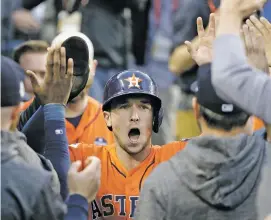  ?? DAVID J. PHILLIP/THE ASSOCIATED PRESS ?? Houston Astros’ Alex Bregman reacts Wednesday after scoring during Game 7 of the World Series against the Dodgers in Los Angeles. Bregman, of Albuquerqu­e, will remain under team control until 2023.