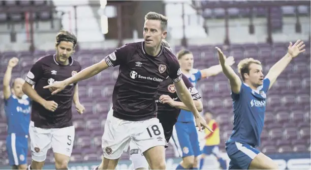  ?? PICTURE: BILL MURRAY/SNS ?? 0 Steven Maclean celebrates the breakthrou­gh goal for Hearts, who can now win their group if they beat Caley Thistle at Tynecastle.