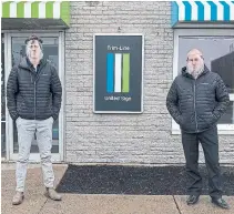  ?? ANDREW VAUGHAN THE CANADIAN PRESS ?? United Sign associate Jonathan Kummer, left, and owner Matt Symes wear face shields they make in Dartmouth, N.S.