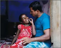  ?? ?? Jerifa Islam spends time with her father, Jaidul Islam, on July 19 at a neighbor’s home in a poor neighborho­od in Bengaluru, India.
