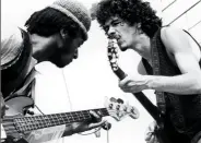  ??  ?? Carlos Santana performs with his bassist David Brown at the first-ever Woodstock festival, August 1969.