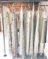  ??  ?? A few wedding dresses still hang on racks in the abandoned bridal boutique in Khyber Pass Rd, Newmarket.