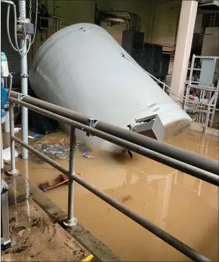  ?? ?? A displaced storage tank inside Upper Gwynedd’s wastewater treatment plant is seen surrounded by stormwater caused by heavy rains during Tropical Storm Isaias on Aug. 4, 2020,