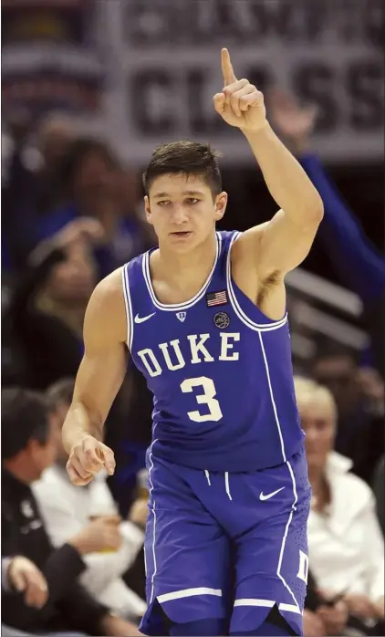  ?? AP photo ?? Duke guard Grayson Allen reacts after making a 3-pointer during the second half of the top-ranked Blue Devils’ 88-81 victory over No. 2 Michigan State on Tuesday.